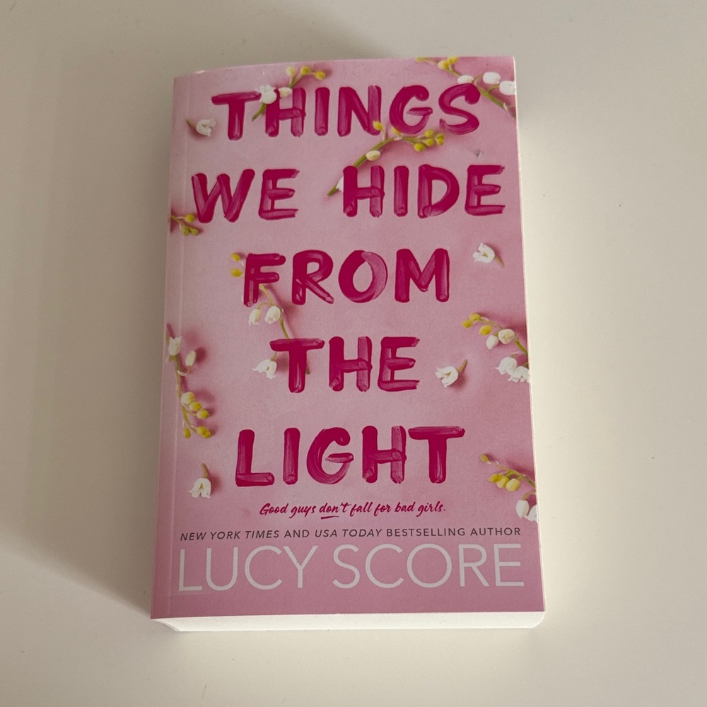 Pink Book 'Things We Hide From the Light' by Lucy Score